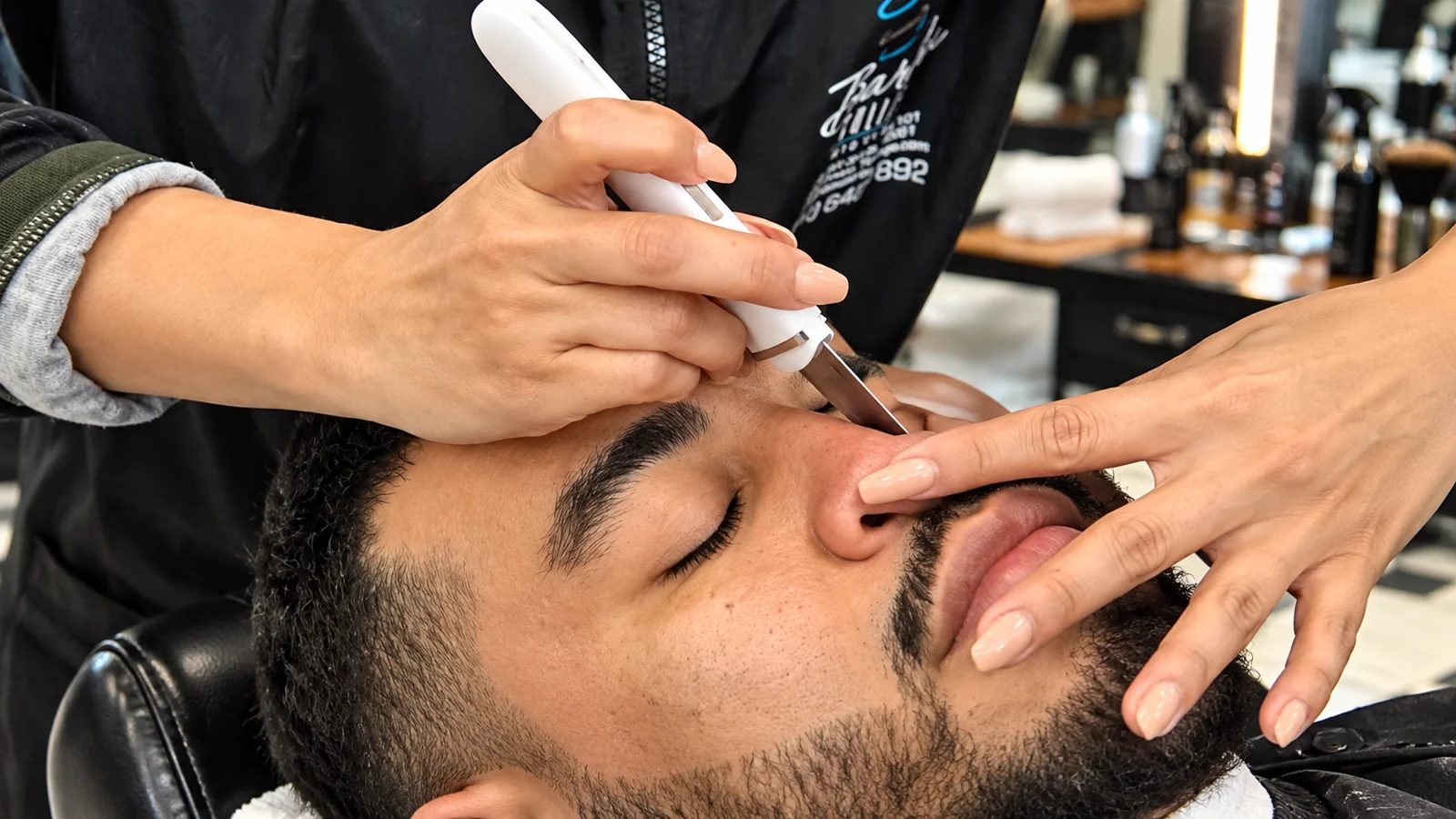 Careful straight razor technique during a beard trim